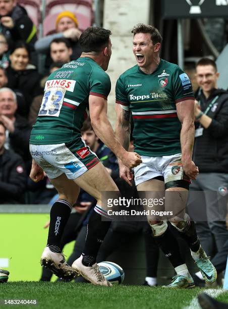 Chris Ashton of Leicester Tigers celebrates with team mate Matt Scott after scoring his 100th try of his career during the Gallagher Premiership...
