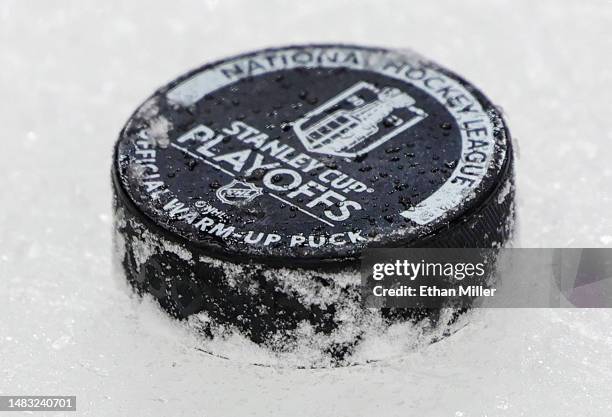 Puck used for warmups is shown on the ice before Game One of the First Round of the 2023 Stanley Cup Playoffs between the Winnipeg Jets and the Vegas...