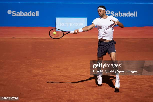 Grigor Dimitrov of Bulgaria plays a forehand shot against Emilio Gomez of Ecuador during their Men's Singles Second Round match on day three of the...