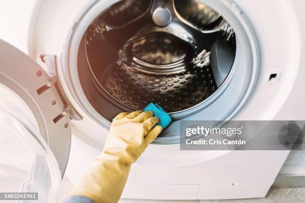 hand cleaning washing machine sealing rubber - washing machine stock pictures, royalty-free photos & images