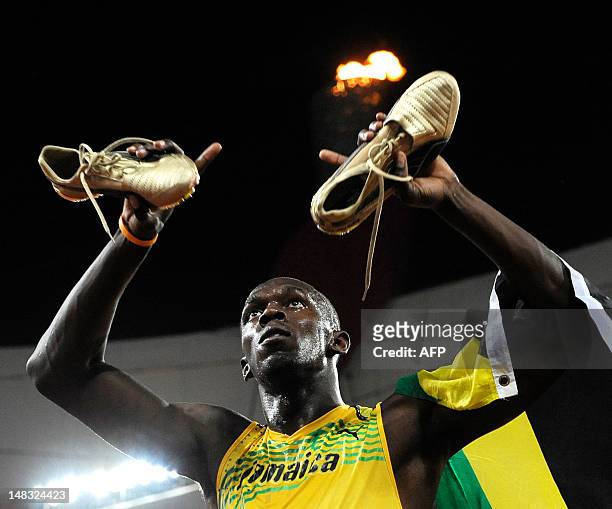 - Picture taken on August 16, 2008 shows Jamaica's Usain Bolt celebrating after winning the men's 100m final at the "Bird's Nest" National Stadium as...
