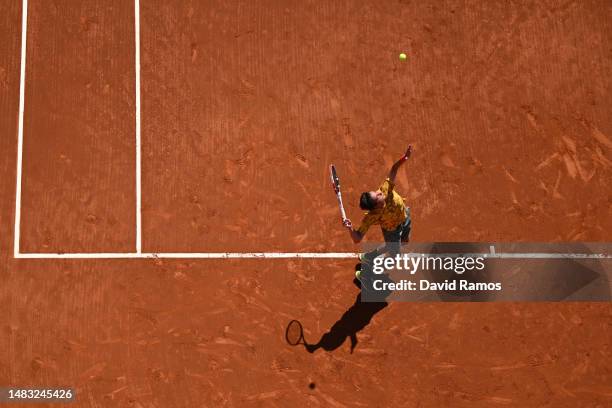 Alexander Shevchenko serves against Alex de Minaur of Australia during the second round match on day three of the Barcelona Open Banc Sabadell 2023...