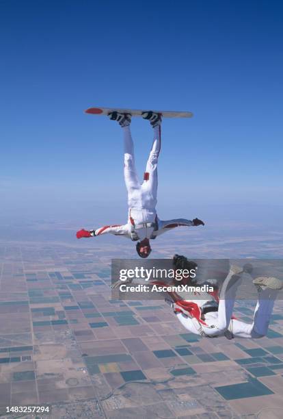 skydiver photographs skyboarder in the air - fallen heroes stock pictures, royalty-free photos & images