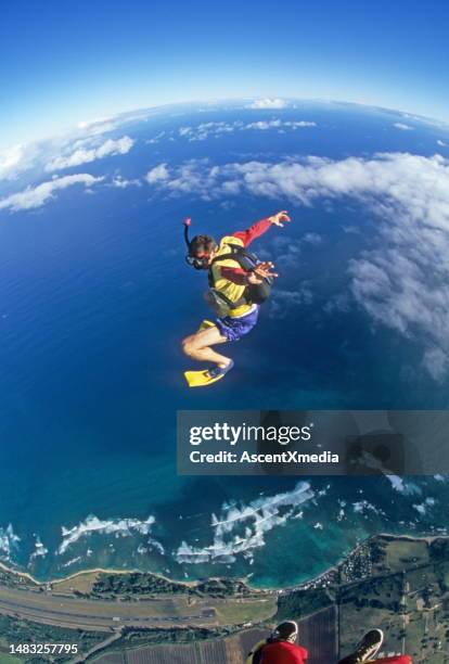 skydiver wearing snorkelling gear in free fall - aerial stunts flying stock pictures, royalty-free photos & images