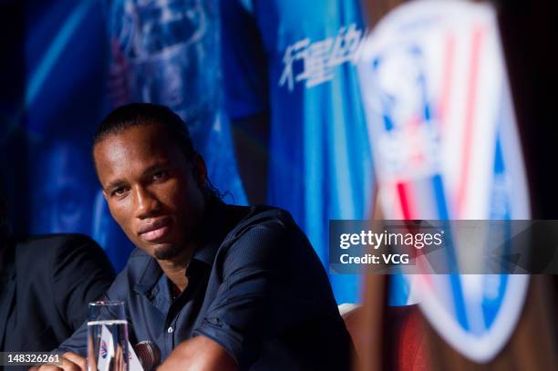 Ivorian football star Didier Drogba attends a press conference to announce his move to Shanghai Shenhua FC, at Ritz-Carlton Hotel on July 14, 2012 in...