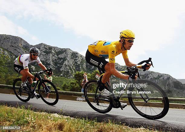 Race leader Bradley Wiggins of Great Britain and SKY Procycling leads team mate Mark Cavendish of Great Britain during stage thirteen of the 2012...