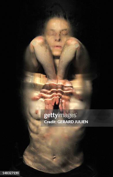 Dancer and choreographer Sandrine Buring performs during a rehearsal of "Ch, on 14 July , 2012 in Avignon, southeastern France, as part of the 66th...