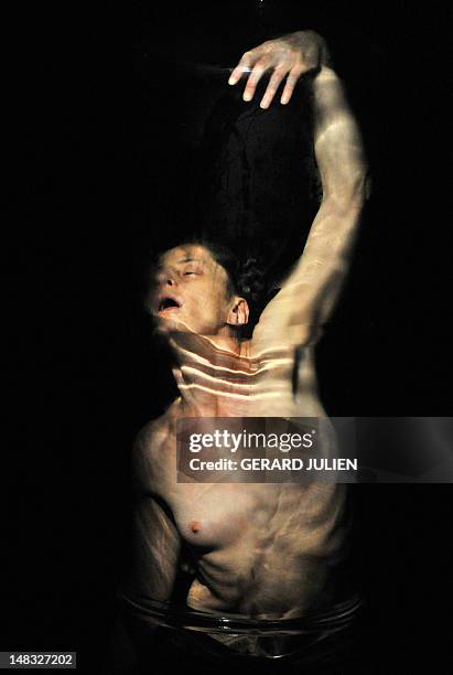 Dancer and choreographer Sandrine Buring performs during a rehearsal of "Ch, on 14 July , 2012 in Avignon, southeastern France, as part of the 66th...