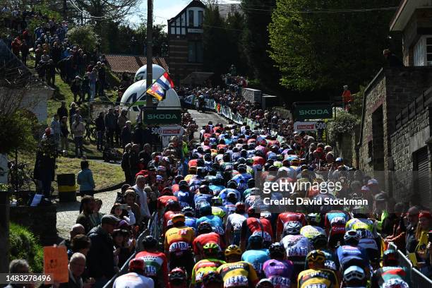 General view of the peloton climbing to the Wall of Geraardsbergen - Mur de Huy while fans cheer during the 87th La Fleche Wallonne 2023, Men's Elite...