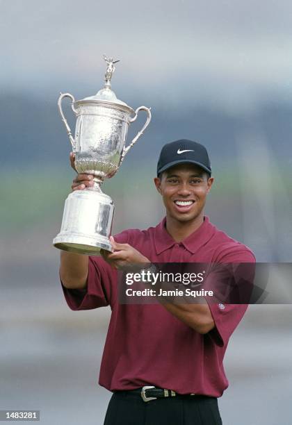 Tiger Woods poses with his trophy after winning the 100th US Open at the Pebble Beach Golf Links in Pebble Beach, California.Mandatory Credit: Jamie...