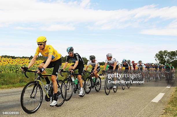 Race leader Bradley Wiggins of Great Britain and SKY Procycling rides in the peloton during stage thirteen of the 2012 Tour de France from Saint-Paul...