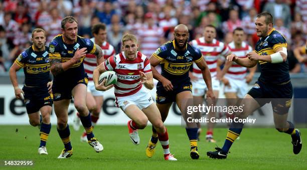 Sam Tomkins of Wigan breaks Leeds line during the Carnegie Challenge Cup Semi Final match between Leeds Rhinos and Wigan Warriors at Galpharm Stadium...