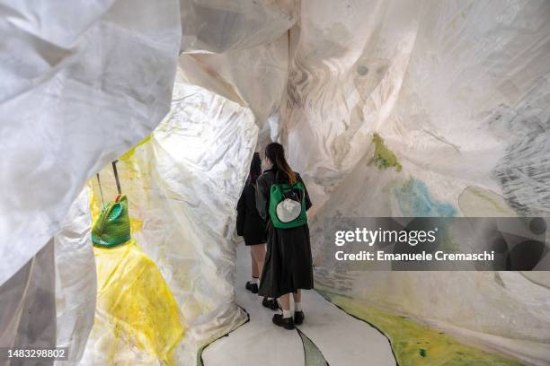 People visit the design exhibition “Vieni a vedere” by Gaetano Pesce at Bottega Veneta flagship store, on April 19, 2023 in Milan, Italy. Every year,...