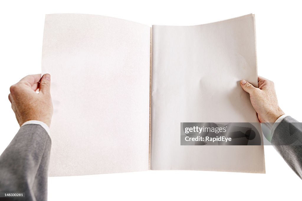 Businessman's hands hold blank newspaper