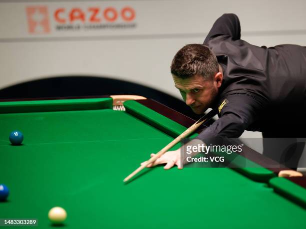 Mark Selby of England plays a shot in the first round match against Matthew Selt of England on day 5 of the 2023 Cazoo World Championship at Crucible...