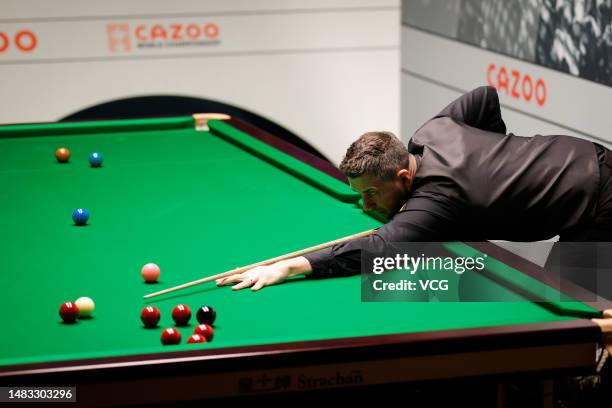 Mark Selby of England plays a shot in the first round match against Matthew Selt of England on day 5 of the 2023 Cazoo World Championship at Crucible...