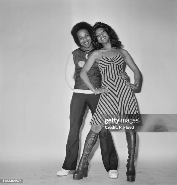 Trinidadian singer Mac Kissoon, wearing a sweater and trousers, with his hands behind his back, with his sister, Trinidadian singer Katie Kissoon,...