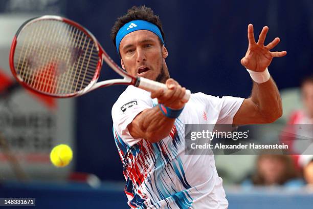 Juan Monaco of Argentinia plays a forehand during his semi finale match against Guillermo Garcia-Lopez of Spain during the Mercedes Cup 2012 at the...