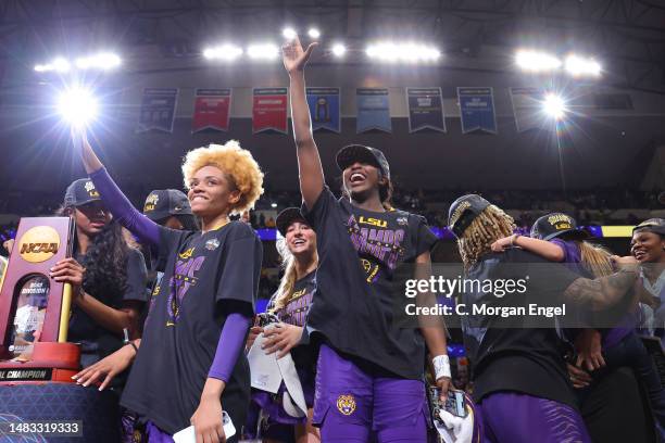 Jasmine Carson of the LSU Lady Tigers celebrates alongside Flau’jae Johnson of the LSU Lady Tigers after defeating the Iowa Hawkeyes during the 2023...