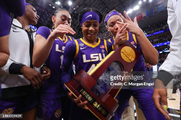 Alexis Morris of the LSU Lady Tigers celebrates with the trophy after defeating the Iowa Hawkeyes during the 2023 NCAA Women's Basketball Tournament...