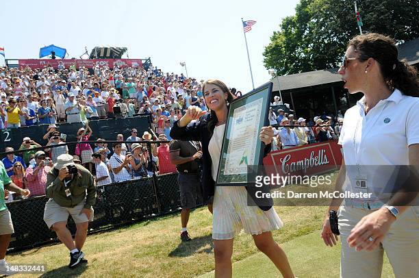 Jennifer Capriati waves to the crowd after being inducted into the International Tennis Hall Of Fame July 14, 2012 in Newport, Rhode Island. Inducted...