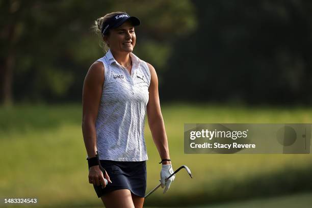 Lexi Thompson of the United States walks down the first fairway during a practice round prior to The Chevron Championship at The Club at Carlton...