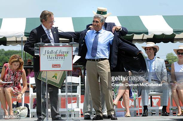 Manuel Orantes receives his blue blazer after being inducted into the International Tennis Hall Of Fame July 14, 2012 in Newport, Rhode Island....