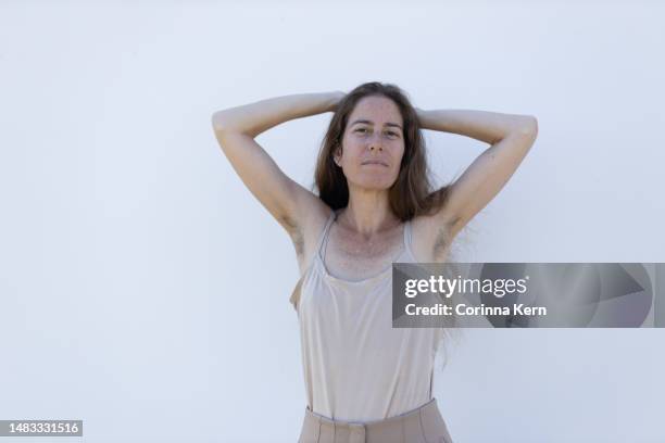 portrait of a woman with armpit hair - armpit hair stock pictures, royalty-free photos & images