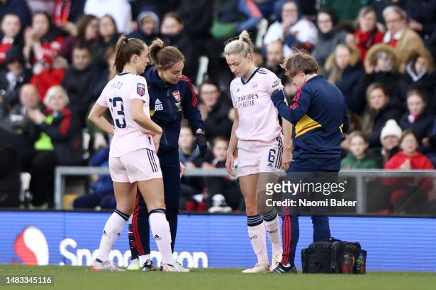 Leah Williamson of Arsenal receives medical treatment during the FA Women's Super League match between Manchester United and Arsenal at Leigh Sports...