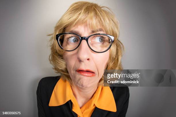 funny fisheye older woman feeling stupid - fumble stock pictures, royalty-free photos & images