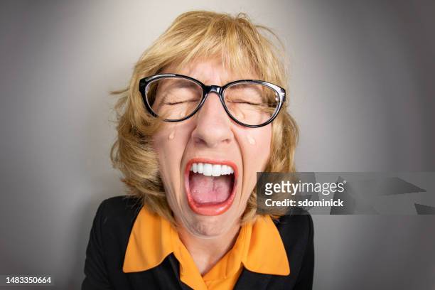 funny fisheye older woman having an ugly cry - unhappy woman blonde glasses stock pictures, royalty-free photos & images