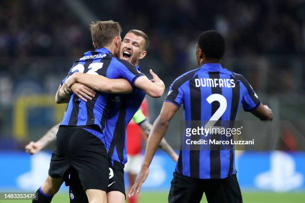 Nicolo Barella of FC Internazionale celebrates with teammate Edin Dzeko after scoring the team's first goal during the UEFA Champions League...