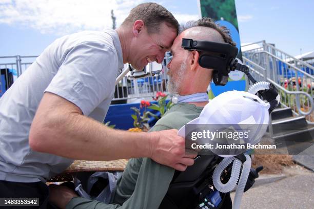 Former NFL safety Steve Gleason is hugged by his former teammate quarterback Drew Brees during the pro-am prior to the Zurich Classic of New Orleans...