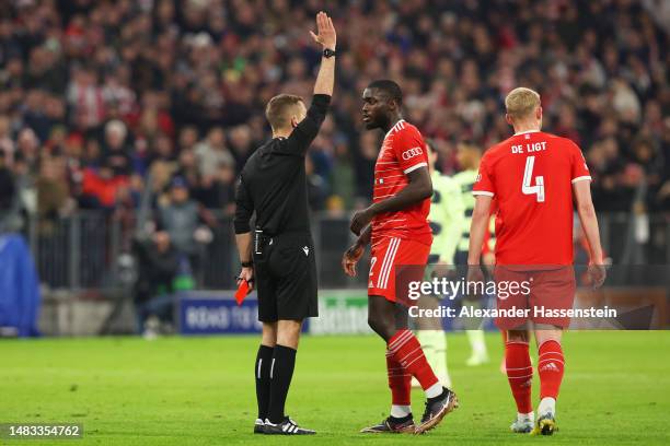 Referee Clement Turpin withdraws the red card originally shown to Dayot Upamecano of FC Bayern Munich after a VAR review for offside during the UEFA...