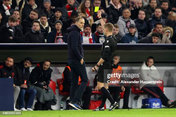 Thomas Tuchel, Head Coach of FC Bayern Munich, is shown a yellow card by Referee Clement Turpin during the UEFA Champions League quarterfinal second...