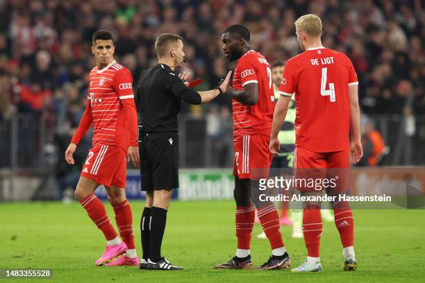 Referee Clement Turpin withdraws the red card originally shown to Dayot Upamecano of FC Bayern Munich after a VAR review for offside during the UEFA...