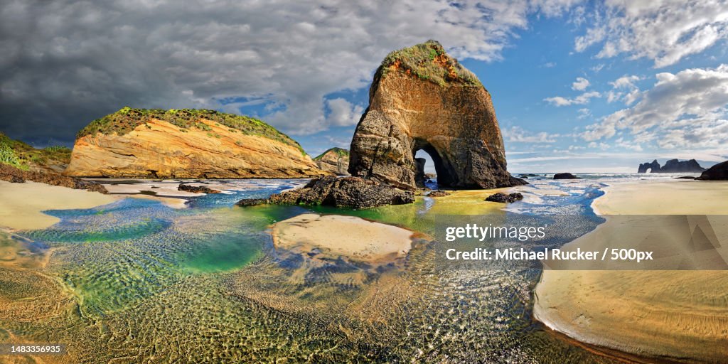 Scenic view of rocks in sea against sky