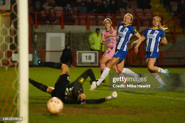 Katja Snoeijs of Everton scores the team's second goal past Lydia Williams of Brighton & Hove Albion during the FA Women's Super League match between...