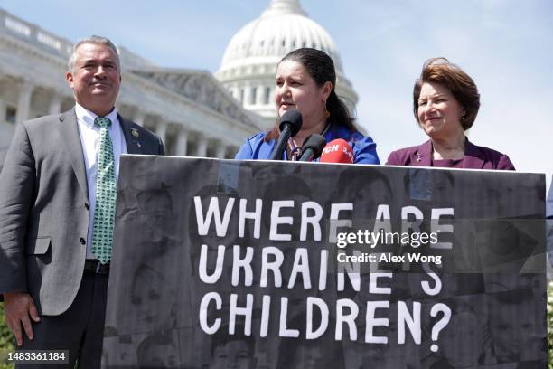 Ukrainian Ambassador to the U.S. Oksana Markarova speaks as U.S. Rep. Don Bacon and Sen. Amy Klobuchar listen during a news conference in front of...