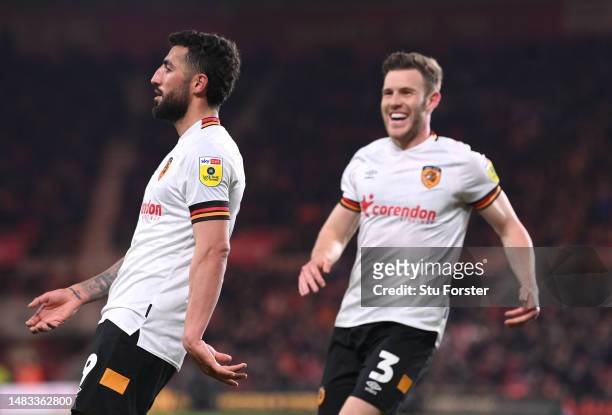 Allahyar Sayyad of Hull celebrates after scoring the first goal with team mate Callum Elder during the Sky Bet Championship between Middlesbrough and...