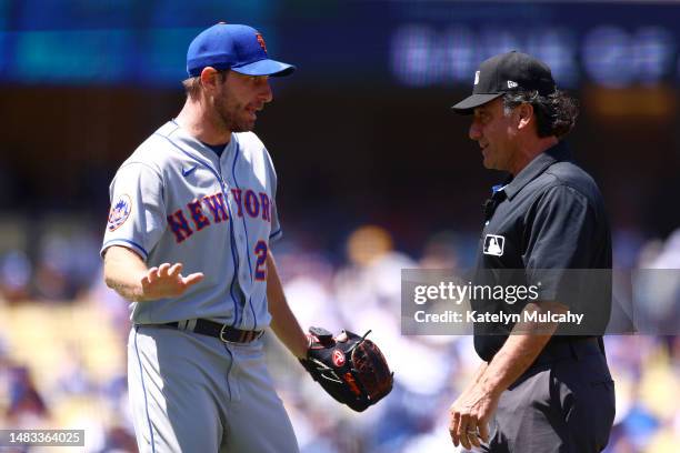 Max Scherzer of the New York Mets argues with umpire Phil Cuzzi during the third inning against the Los Angeles Dodgers at Dodger Stadium on April...