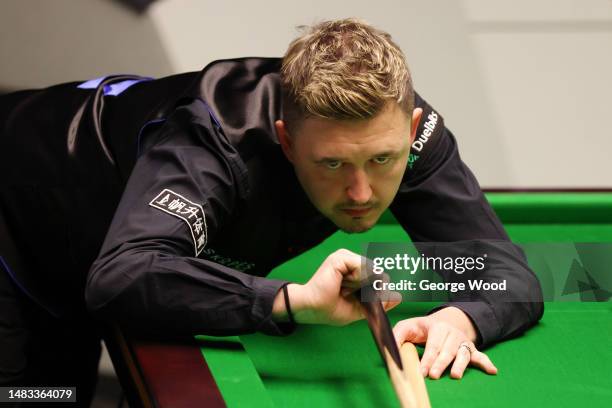 Kyren Wilson of England plays a shot during their round one match against Ryan Day of Wales on Day Five of the Cazoo World Snooker Championship 2023...