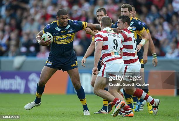 Ryan Bailey of Leeds is tackled Jack Hughes and Michael McIlorum of Wigan during the Carnegie Challenge Cup Semi Final match between Leeds Rhinos and...