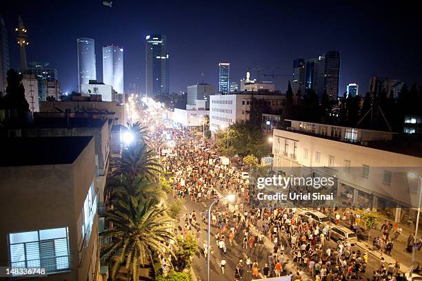 Demonstrators march through the streets to protest rising housing costs on July 14, 2012 in Tel Aviv, Israel. Growing discontent among Israelis over...