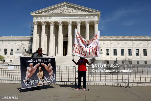 Abortion rights activists hold up signs outside the U.S. Supreme Court Building on April 19, 2023 in Washington, DC. Today U.S. Supreme Court Justice...