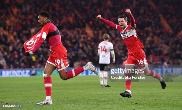 Middlesbrough player Chuba Akpom celebrates with Jonny Howson after scoring the third Boro goal during the Sky Bet Championship between Middlesbrough...