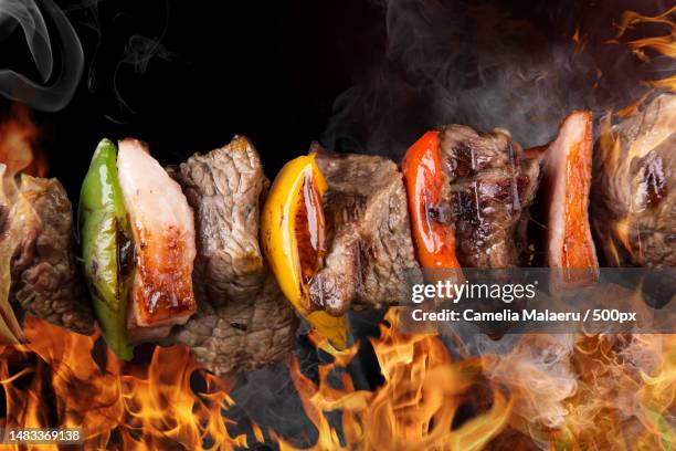 close-up of meat on barbecue grill,romania - schaschlik stock-fotos und bilder
