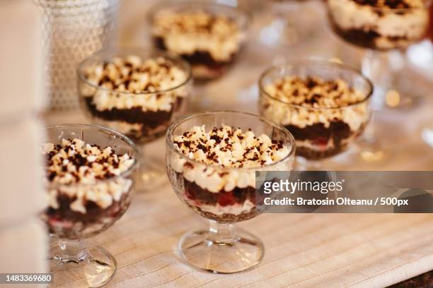 tiramisu desserts in a glass dessert bowl on table on party - ティラミス　ガラス ストックフォトと画像