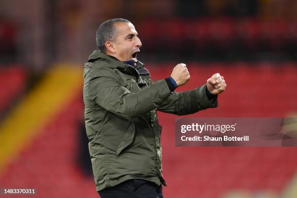 Sabri Lamouchi, Manager of Cardiff City, celebrates towards the fans after the team's victory in the Sky Bet Championship match between Watford and...