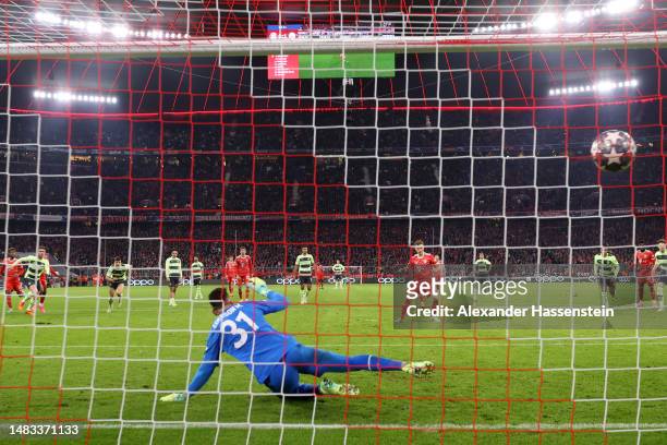 Joshua Kimmich of FC Bayern Munich scores the team's first goal from a penalty kick past Ederson of Manchester City during the UEFA Champions League...